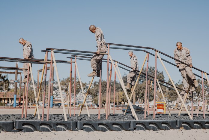 U.S. Marine Corps recruits with Fox Company, 2nd Recruit Training Battalion, navigate through an obstacle during a confidence course training event at Marine Corps Recruit Depot San Diego, California, Oct. 24, 2024. The confidence course challenges recruits physically and mentally through obstacles that require confidence in their strength, balance, and determination. (U.S. Marine Corps photo by Cpl. Sarah M. Grawcock)