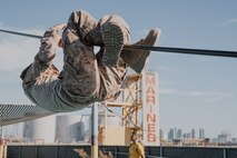 A U.S. Marine Corps recruit with Fox Company, 2nd Recruit Training Battalion, navigates through an obstacle during a confidence course training event at Marine Corps Recruit Depot San Diego, California, Oct. 24, 2024. The confidence course challenges recruits physically and mentally through obstacles that require confidence in their strength, balance, and determination. (U.S. Marine Corps photo by Cpl. Sarah M. Grawcock)