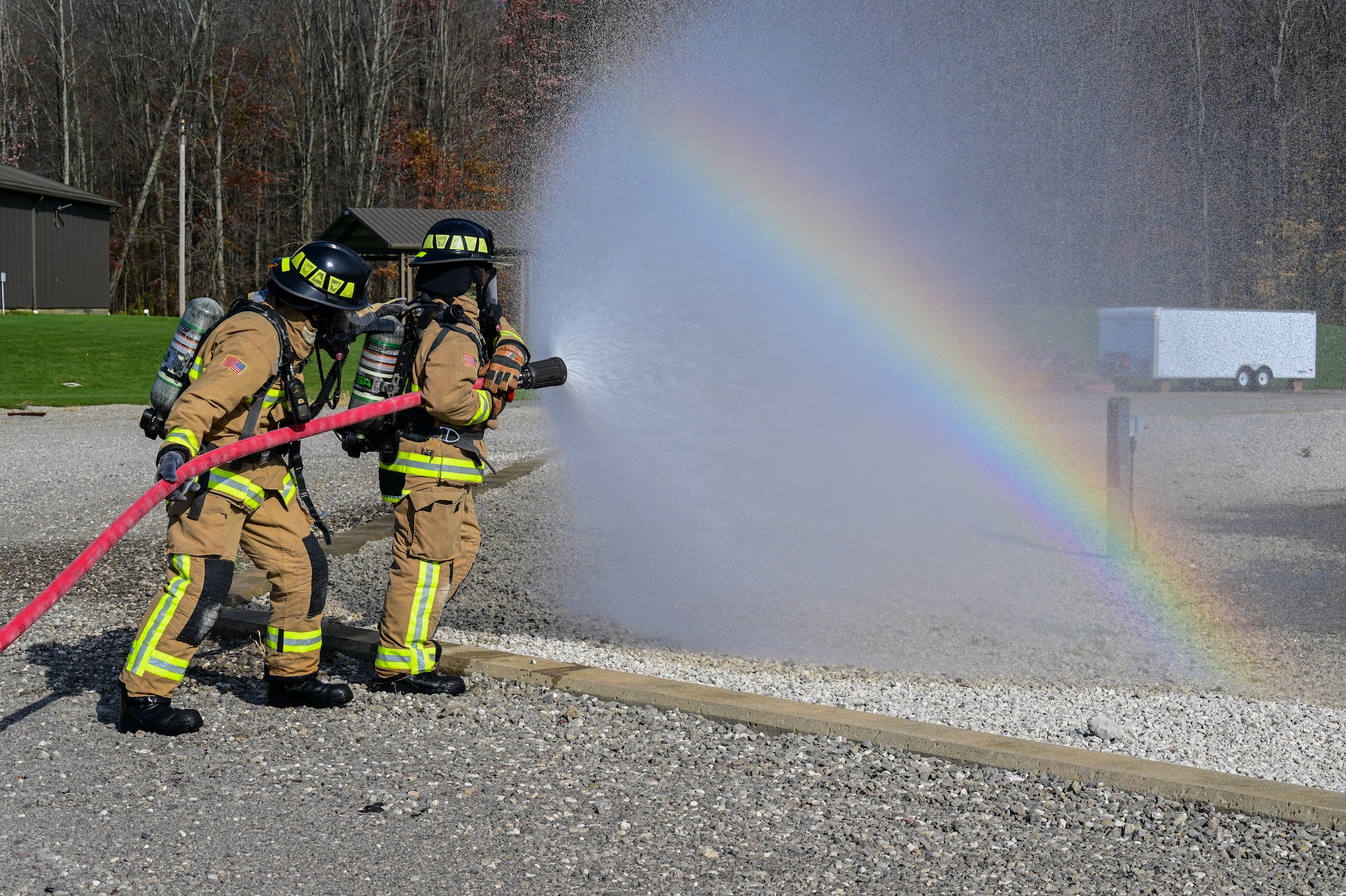 Firefighters assigned to the 910th Civil Engineer Squadron fight a simulated aircraft fire, Nov. 4, 2024, during Combat Readiness Exercise Buckeye II at Youngstown Air Reserve Station, Ohio.
