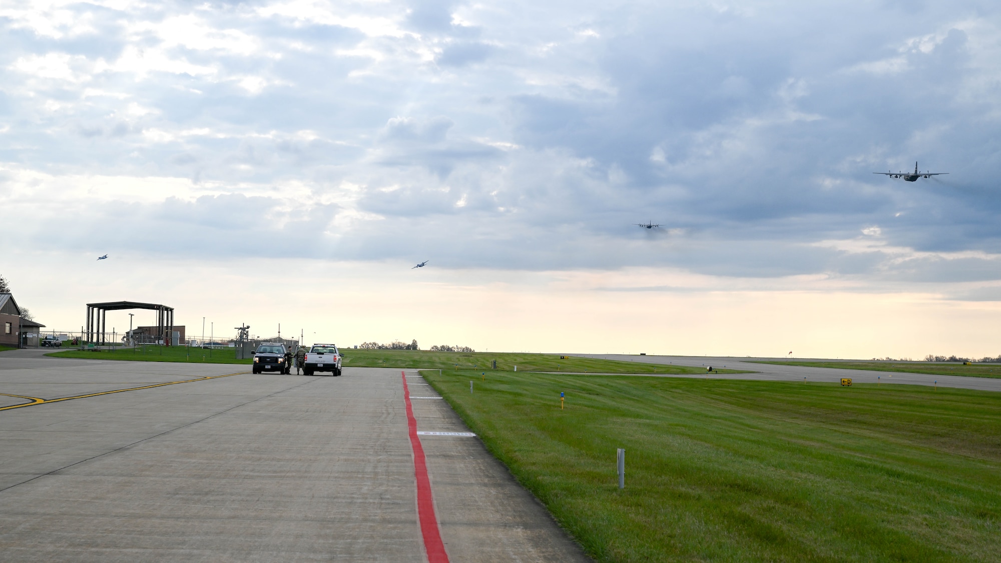 C-130H Hercules aircraft assigned to the 910th Airlift Wing take off together, Nov. 4, 2024, during Combat Readiness Exercise Buckeye II at Youngstown Air Reserve Station, Ohio.