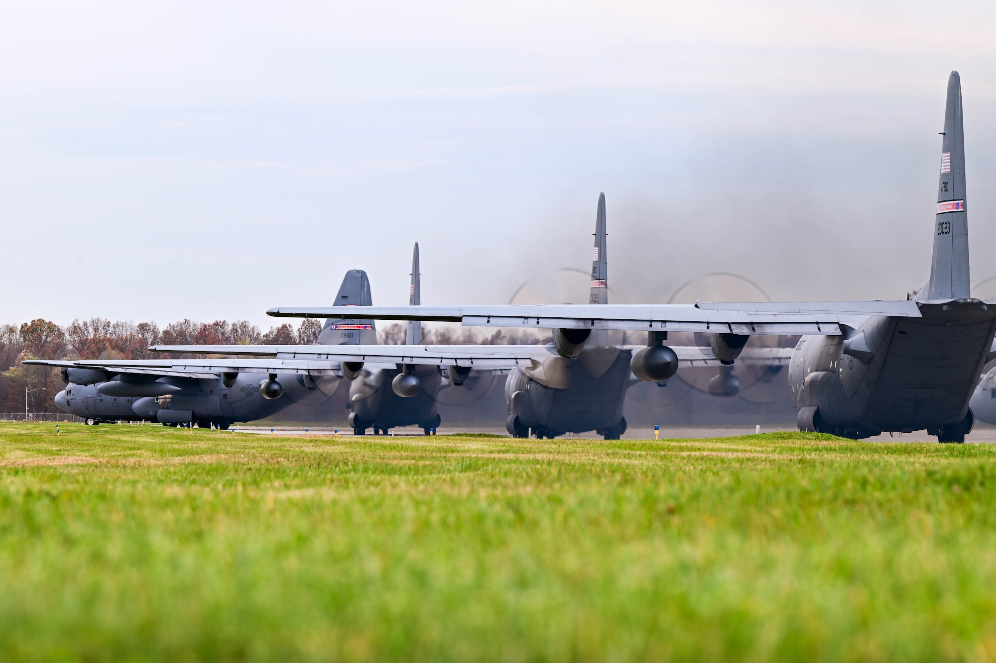 C-130H Hercules aircraft assigned to the 910th Airlift Wing taxi in formation to take off, Nov. 4, 2024, during Combat Readiness Exercise Buckeye II at Youngstown Air Reserve Station, Ohio.