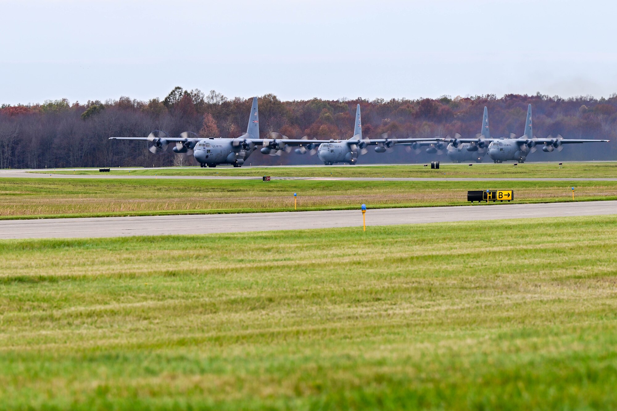 The lead C-130H Hercules aircraft assigned to the 910th Airlift Wing in formation begins its take-off, Nov. 4, 2024, during Combat Readiness Exercise Buckeye II at Youngstown Air Reserve Station, Ohio.