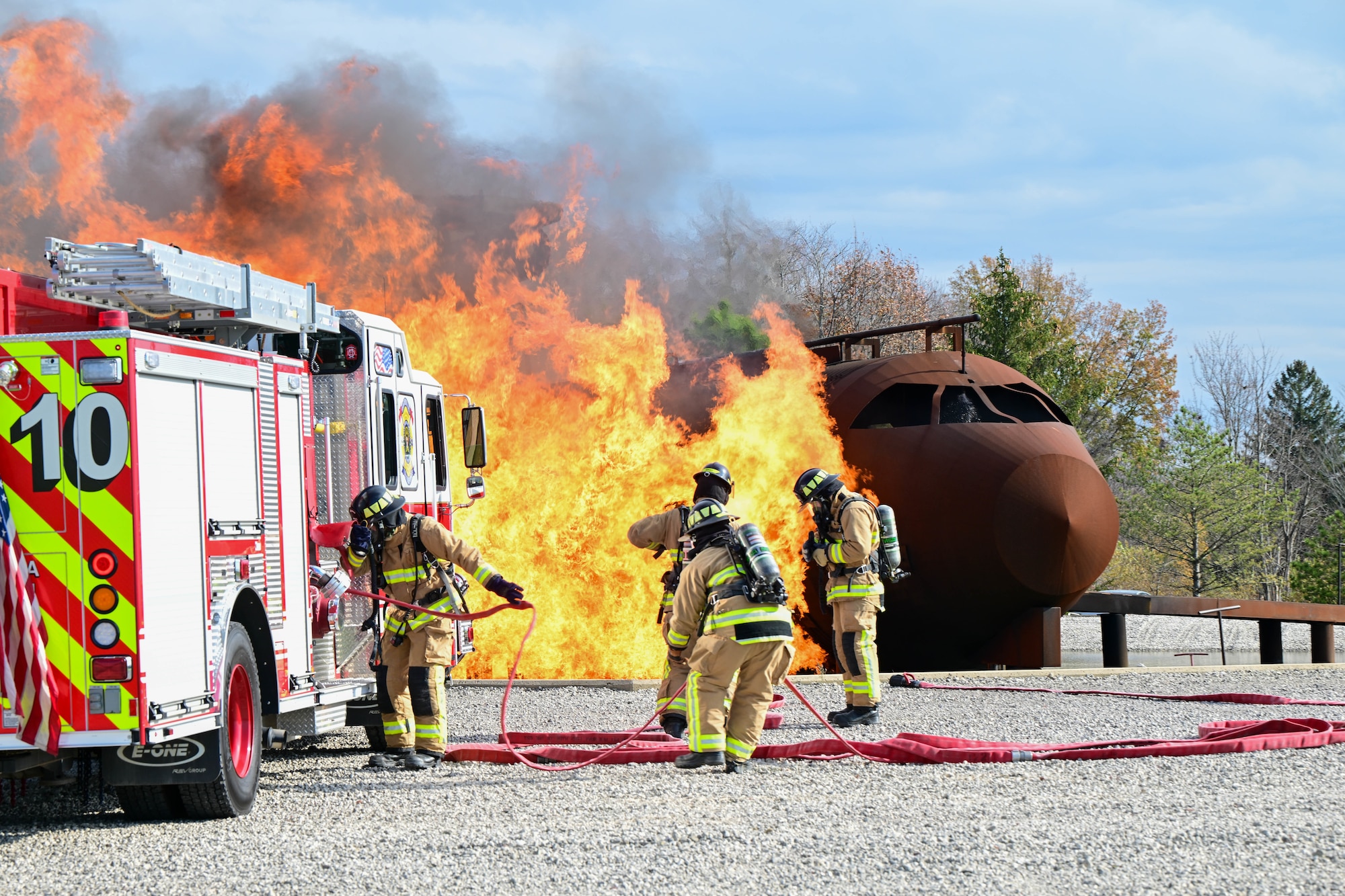 Firefighters assigned to the 910th Civil Engineer Squadron respond to a simulated aircraft fire, Nov. 4, 2024, during Combat Readiness Exercise Buckeye II at Youngstown Air Reserve Station, Ohio.