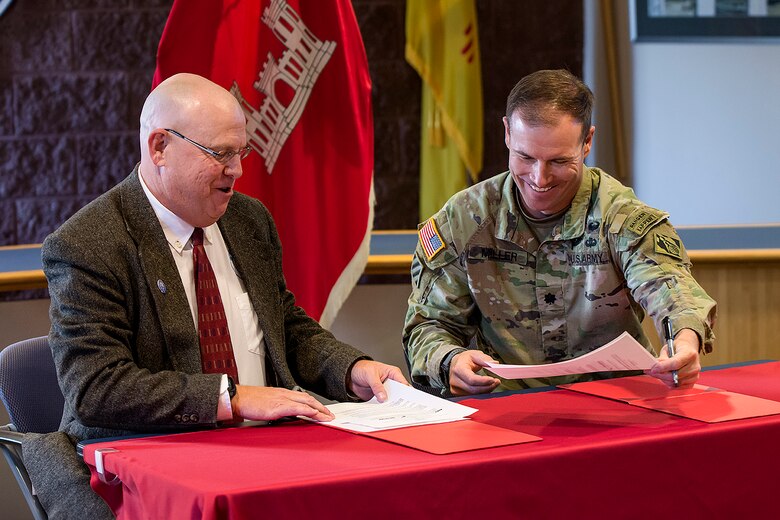 David Gatterman, left, SSCAFCA executive engineer, and Lt. Col. Matthew Miller, Albuquerque District commander, sign the PPA, Oct. 8, 2024.