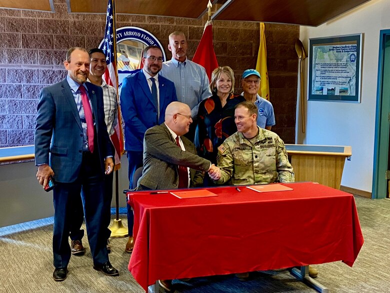 Front Row: David Gatterman, SSCAFCA executive engineer, and Lt. Col. Matthew Miller, Albuquerque District commander. Back Row, (l-r): Greg Hull, mayor, Rio Rancho; Brian Sanchez, Albuquerque District program manager; Jacob Pauley, deputy district engineer, Albuquerque District; SSCAFCA Board Members. Not Pictured: Martina Suazo, Albuquerque District program manager.