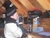 Civil Air Patrol Lt. Col. Bryan 
Emerson, Alaska Wing director of 
communications, tests a new High 
Frequency radio at his remote 
Alaska homestead during a recent 
communications exercise. During 
the exercise, members of the 
Alaska CAP Wing used HF radio to
reach far away as Arizona, 
Colorado, Alabama and New 
Hampshire. (Courtesy Photo)