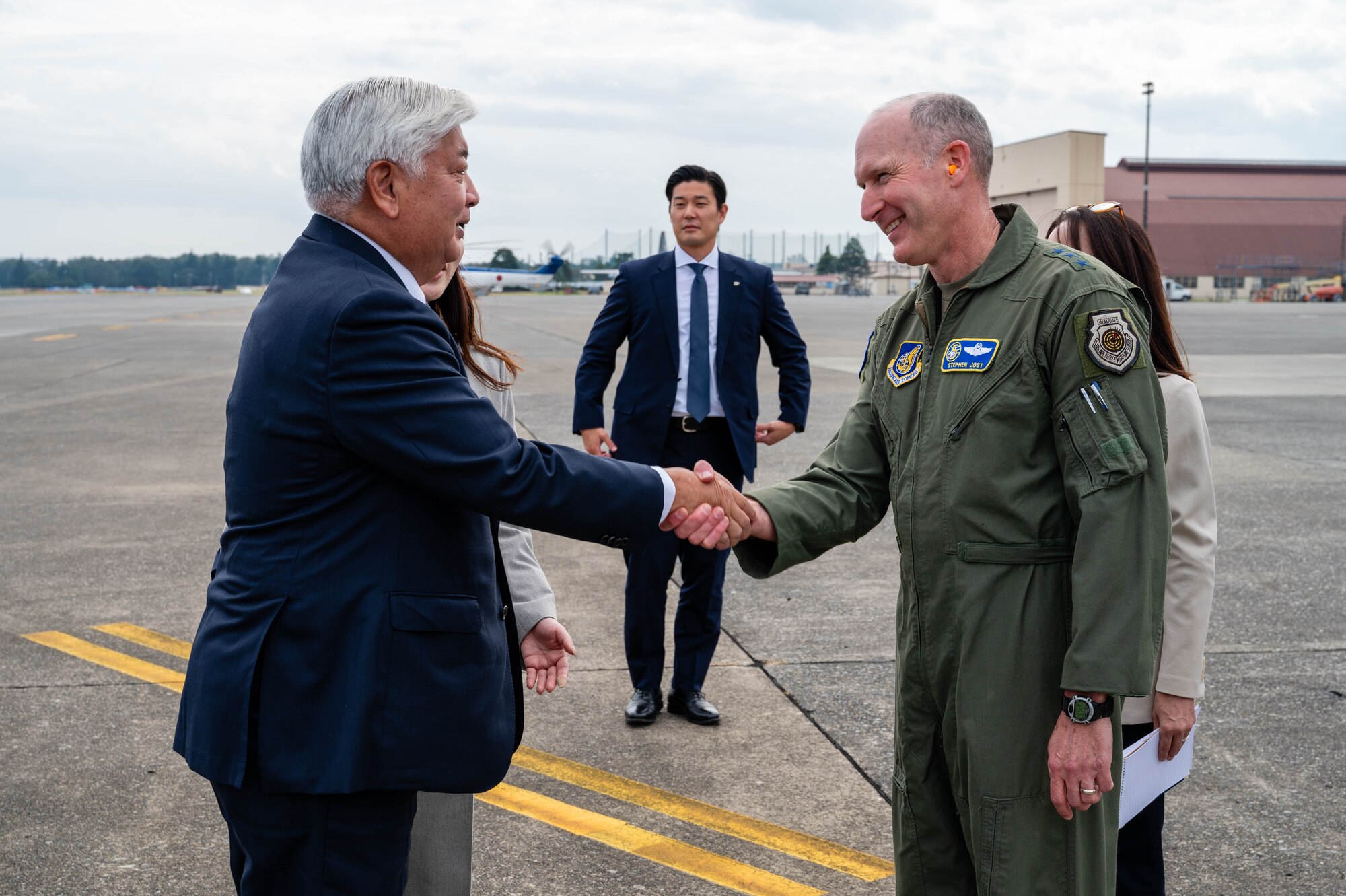 U.S. Air Force Lt. Gen. Stephen Jost, U.S. Forces Japan and Fifth Air Force commander, shakes hands with Honorable Gen Nakatani, Japan's Minister of Defense, at Yokota Air Base, Japan.