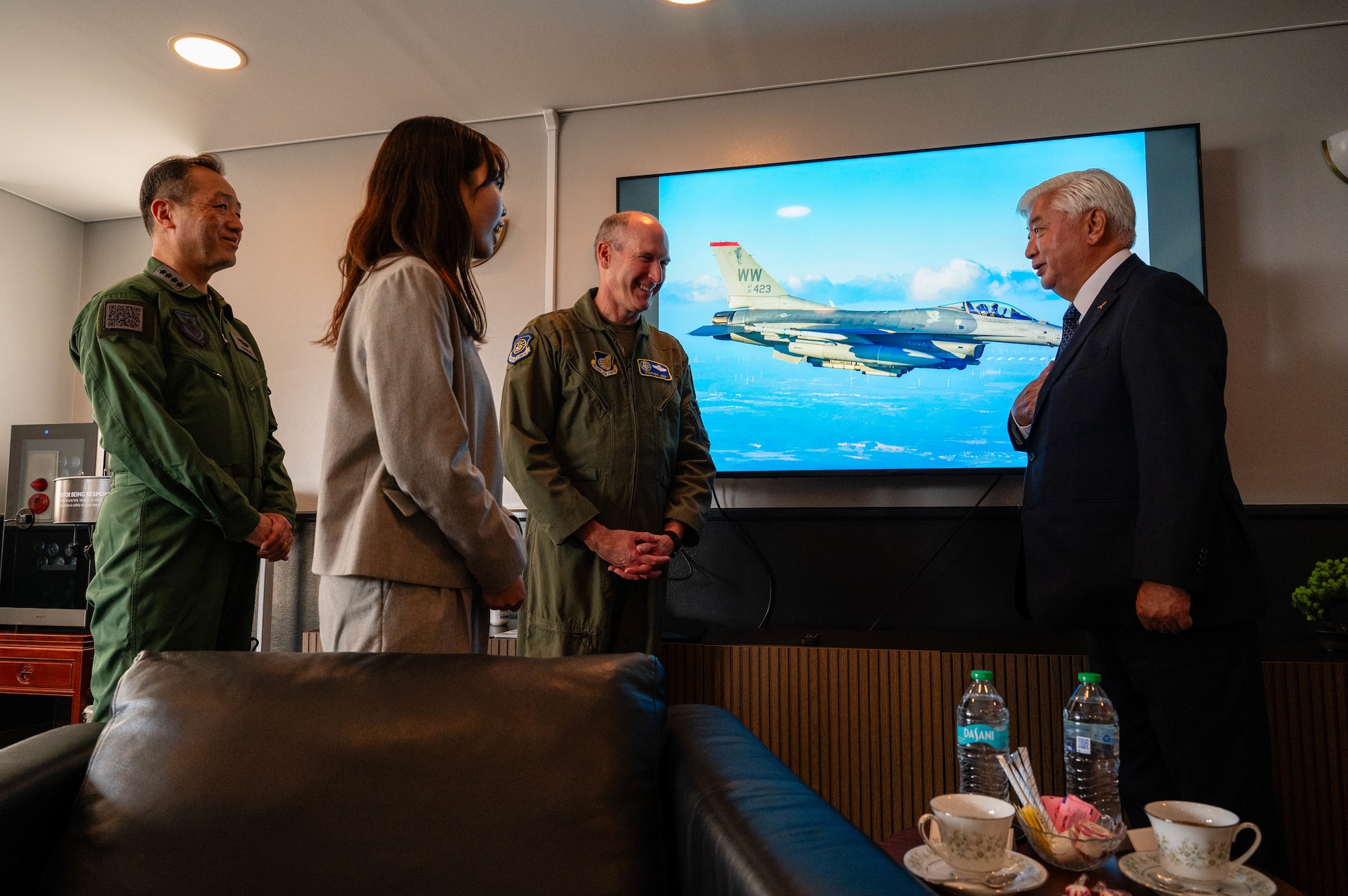 U.S. Air Force Lt. Gen. Stephen Jost, U.S. Forces Japan and Fifth Air Force commander, and Honorable Gen Nakatani, Japan's Minister of Defense, engage in conversation in the distinguished visitor lounge at Yokota Air Base, Japan.