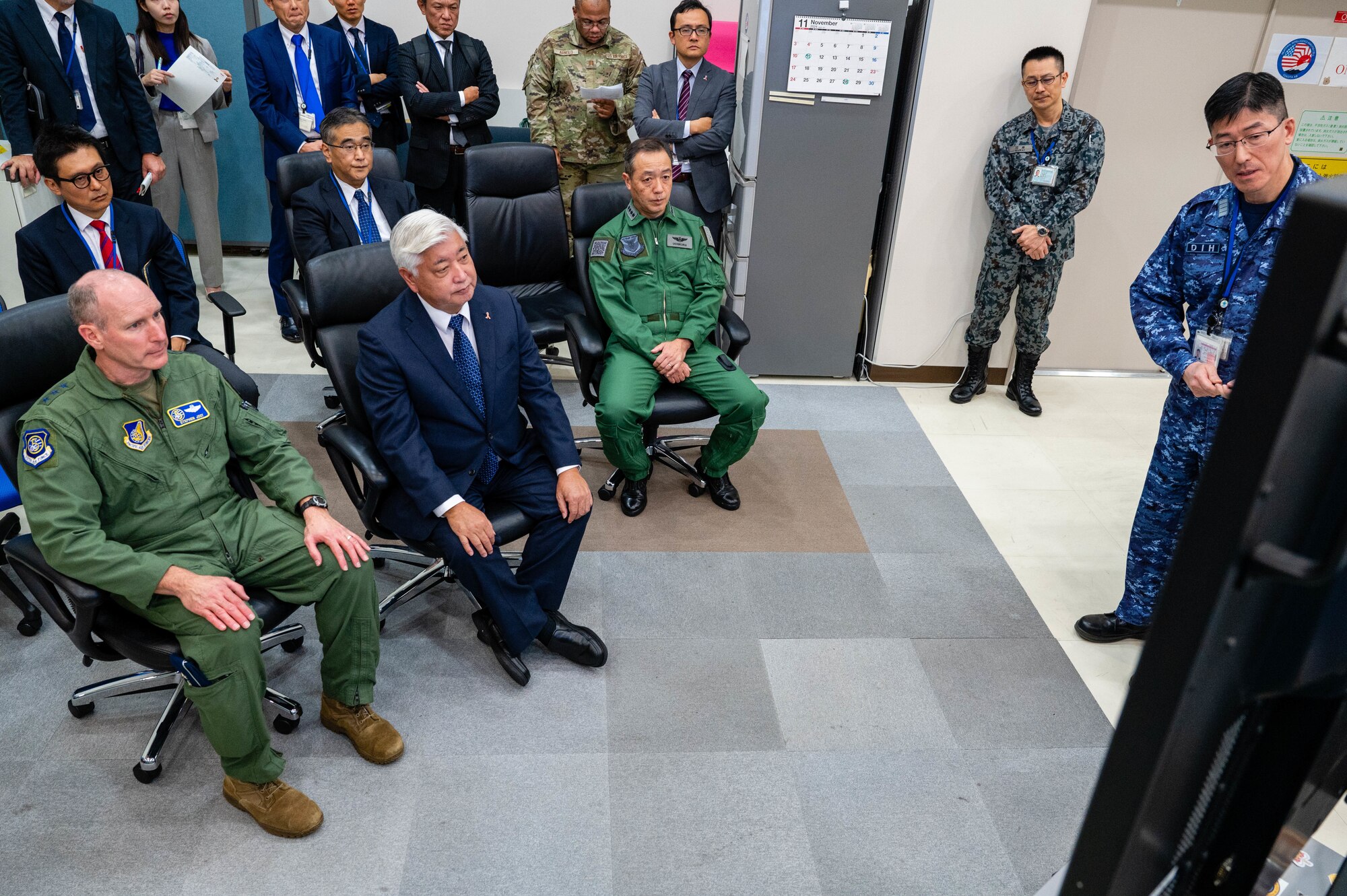 U.S. Air Force Lt. Gen. Stephen Jost, U.S. Forces Japan and Fifth Air Force commander, and Honorable Gen Nakatani, Japan’s Minister of Defense, receive a briefing in the Bilateral Intelligence Analysis Cell at Yokota Air Base, Japan.