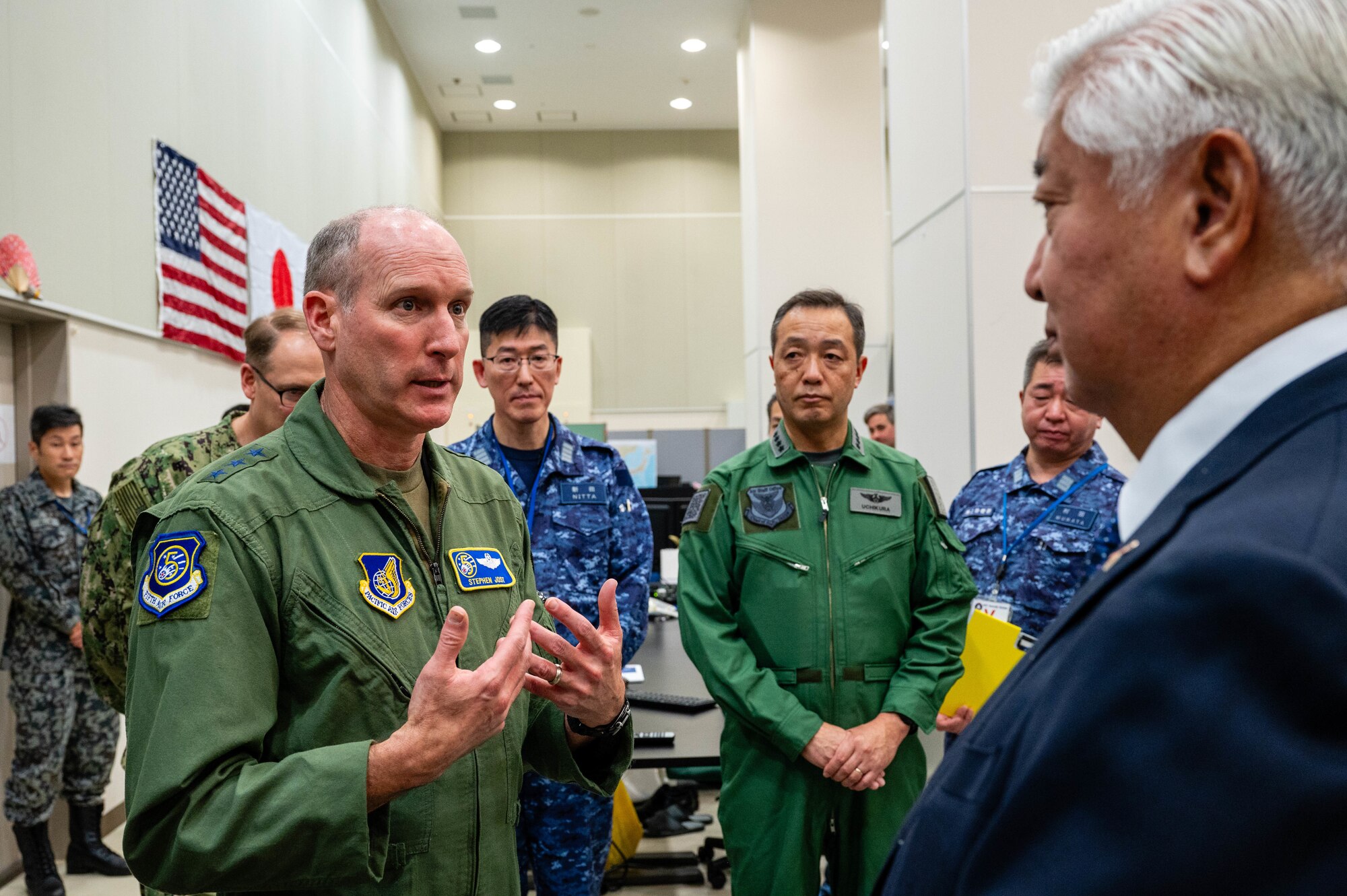 U.S. Air Force Lt. Gen. Stephen Jost, U.S. Forces Japan and Fifth Air Force commander, speaks to Honorable Gen Nakatani, Japan's Minister of Defense, in the Bilateral Intelligence Analysis Cell at Yokota Air Base, Japan.