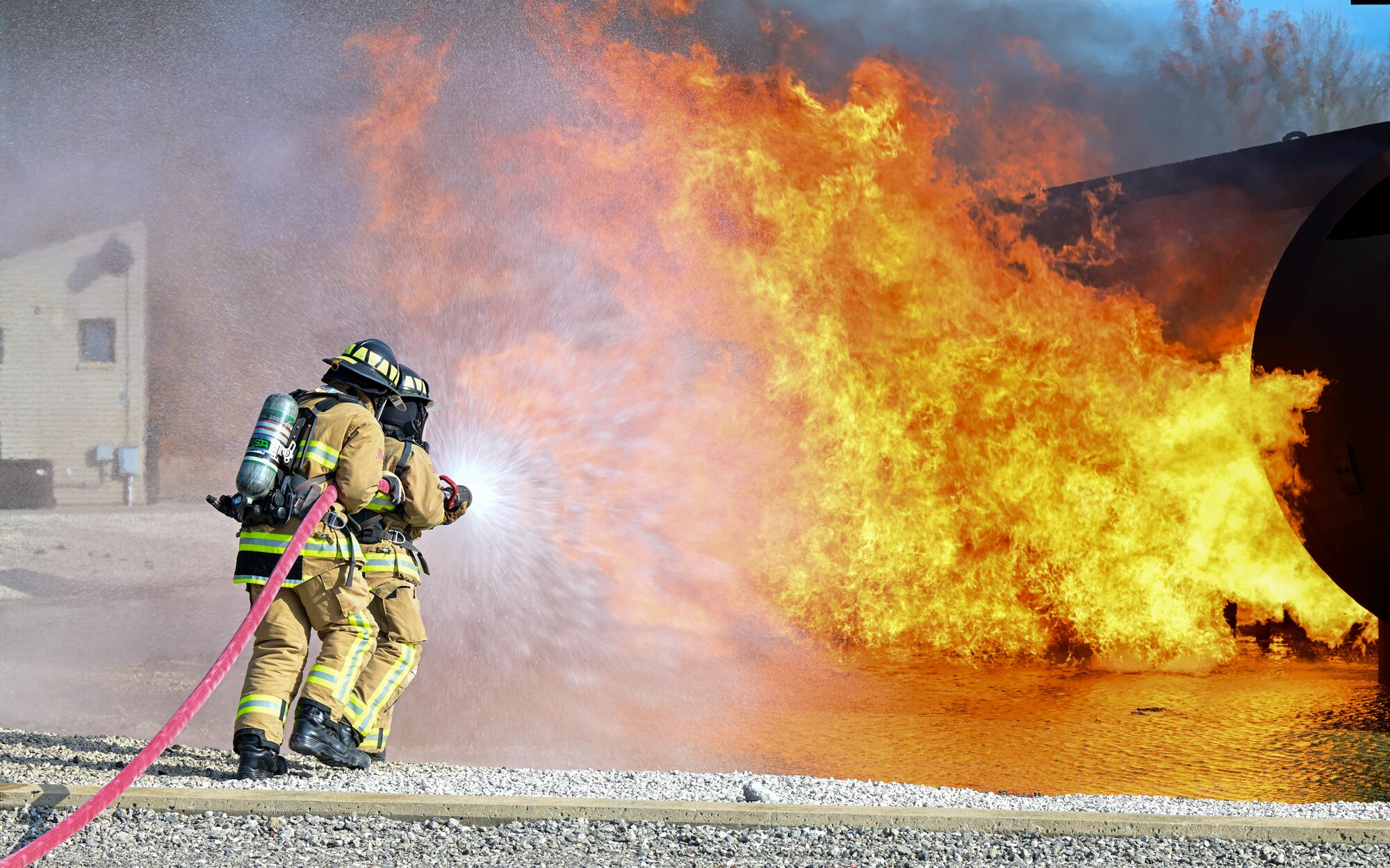 Firefighters assigned to the 910th Civil Engineer Squadron fight a simulated aircraft fire, Nov. 4, 2024, during Combat Readiness Exercise Buckeye II at Youngstown Air Reserve Station, Ohio.