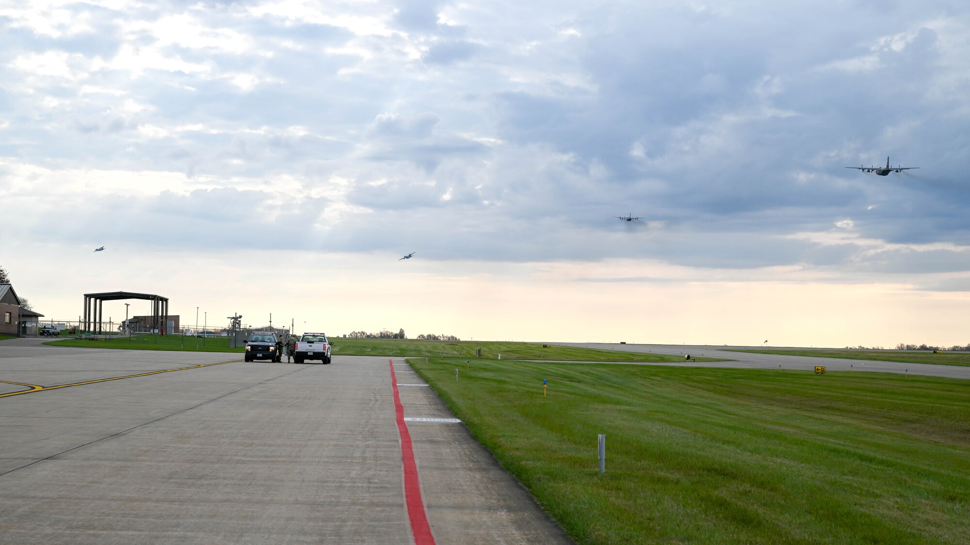 C-130H Hercules aircraft assigned to the 910th Airlift Wing take off together, Nov. 4, 2024, during Combat Readiness Exercise Buckeye II at Youngstown Air Reserve Station, Ohio.