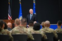 Secretary of the Air Force speaks to Airmen in an auditorium
