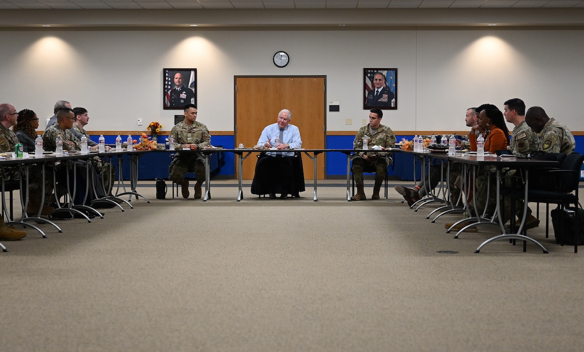 Secretary of the Air Force sits and eats lunch with Airmen
