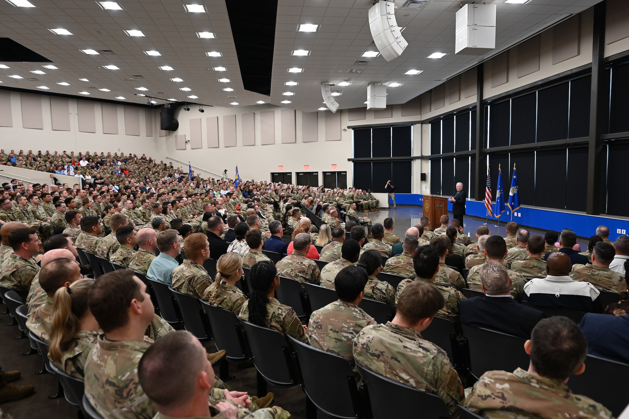 The Secretary of the Air Force speaks to Airmen in an auditorium.