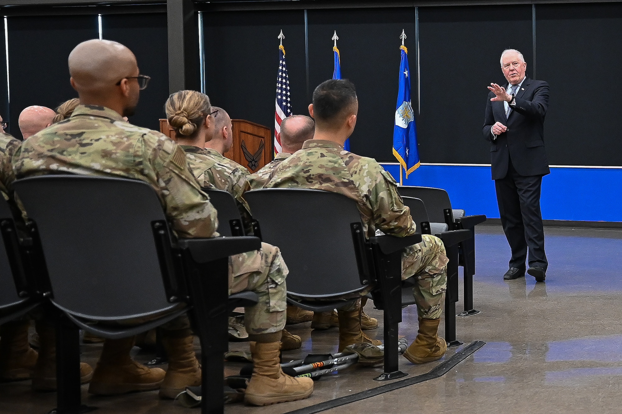 The Secretary of the Air Force speaks to Airmen in an auditorium
