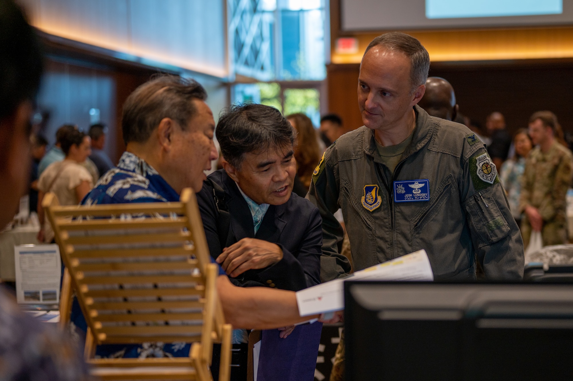 Military member and civilian contractors read vendor information