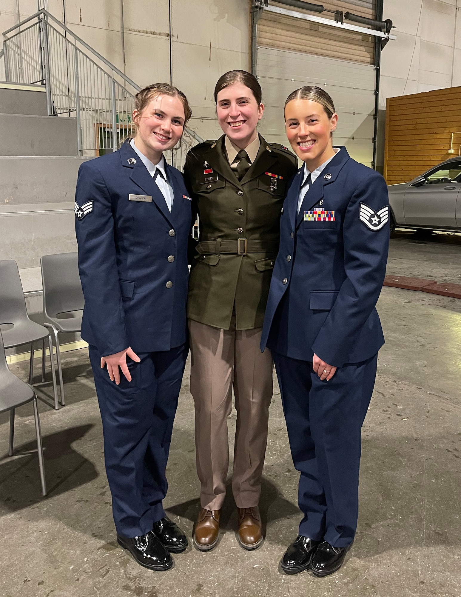U.S. Air Force Airman 1st Class Bridget Johnson, left, U.S. Army Spc. Jadyn Byers, center, and U.S. Air Force Staff Sgt. Skylar Gunderson, right, poses for a photo at the Norwegian Reciprocal Troop Exchange (NOREX) 51 farewell banquet at Værnes Garrison, Norway, Feb. 12, 2024.