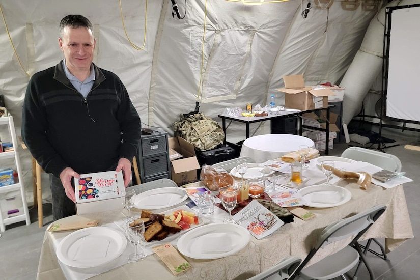 U.S. Army Maj. Aaron Gaber, a Jewish chaplain with the 56th Stryker Brigade Combat Team, 28th Infantry Division, Pennsylvania National Guard, prepares a special meal for Rosh Hashanah in Torun, Poland, Oct. 5, 2025. Gaber visited several locations across U.S. European Command to provide religious support to Soldiers celebrating the Jewish High Holy Days. (U.S. Army National Guard photo by Staff Sgt. John Mateja)