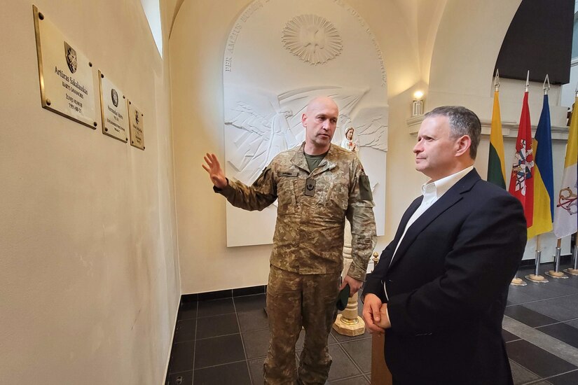 U.S. Army Maj. Aaron Gaber, right, a Jewish chaplain with the 56th Stryker Brigade Combat Team, 28th Infantry Division, Pennsylvania National Guard, is guided around the Cathedral of St. Ignatius of Loyola by Maj. Mindaugas Sabonis, a Military Ordinariate of Lithuania, Oct. 10, 2024. Gaber visited several locations across U.S. European Command to provide religious support to Soldiers celebrating the Jewish High Holy Days. This stop to Vilnius reaffirmed the state partnership that the Pennsylvania National Guard has had with the country of Lithuania since 1993. (U.S. Army National Guard photo by Staff Sgt. John Mateja)