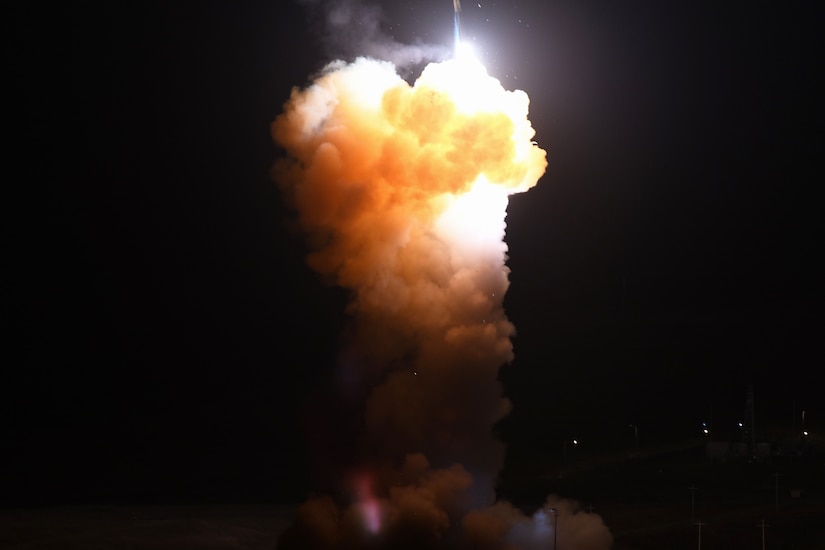 A missile launches creating large clouds of fiery smoke.