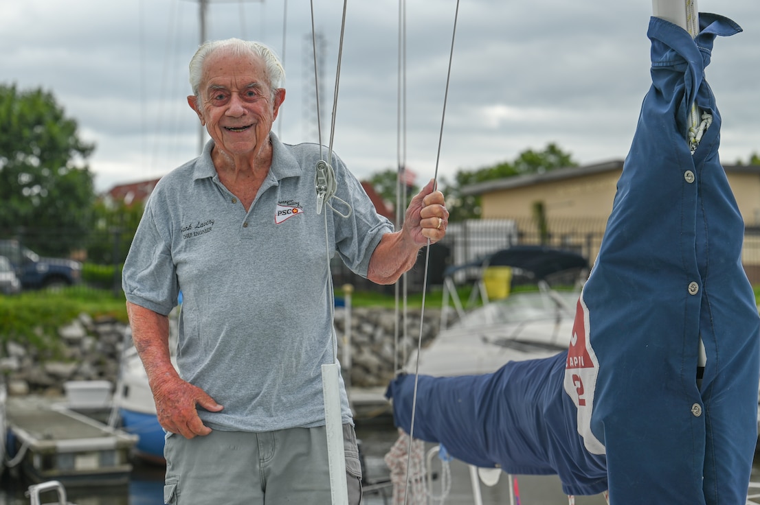 retired pilot poses for photos