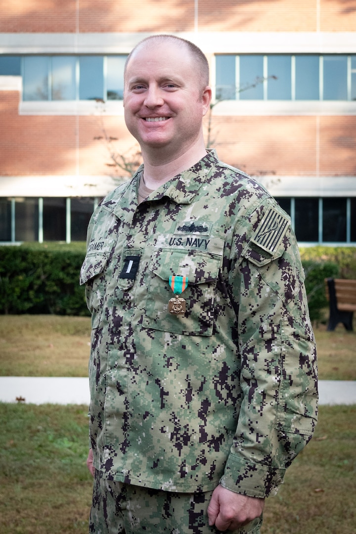 Lieutenant Junior Grade James Cramer serves in the Patient Centered Medical Home Port aboard Naval Health Clinic Cherry Point providing care to service members assigned to Marine Corps Air Station Cherry Point and their families.
He was presented the Navy and Marine Corps Achievement Medal during a ceremony Wednesday, October 30 for his service as a Staff Nurse at Naval Hospital Bremerton in Washington state.  There, Cramer led a 16-person team delivering care while improving the hospital’s onboarding procedures.