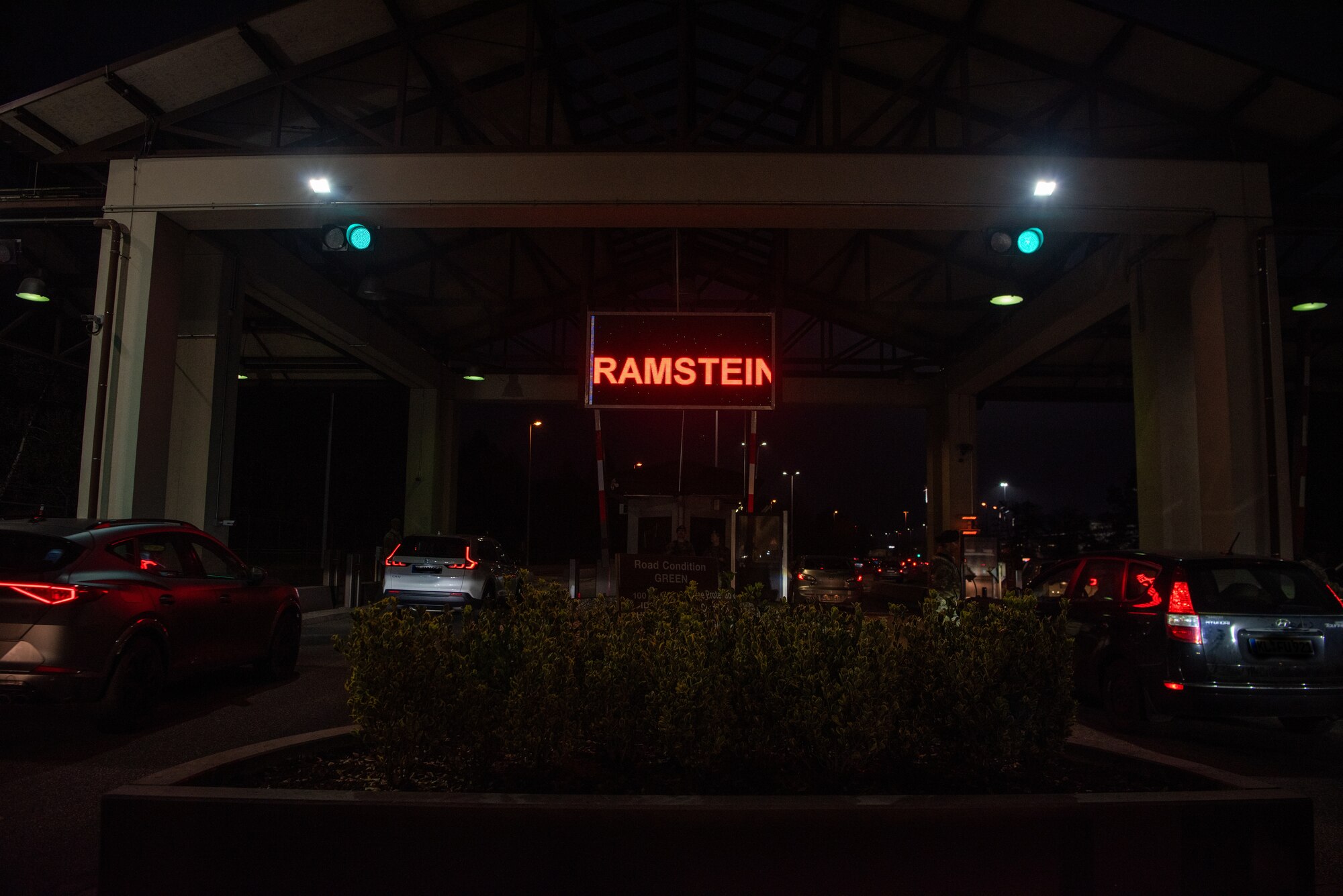 Cars line up at gate.