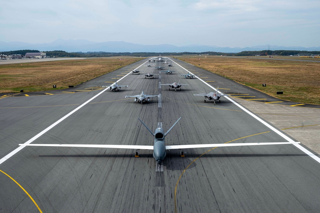 Air Force F-16 Fighting Falcons, a Navy P-8 Poseidon, a Navy C-12 Huron, Japanese F-35A Lightning II Joint Strike Fighters, Japanese F-2s, a Japanese E-2D Hawkeye and a Japanese RQ-4B Global Hawk perform a wing capabilities demonstration during Keen Sword at Misawa Air Base, Japan, Nov. 1, 2024.