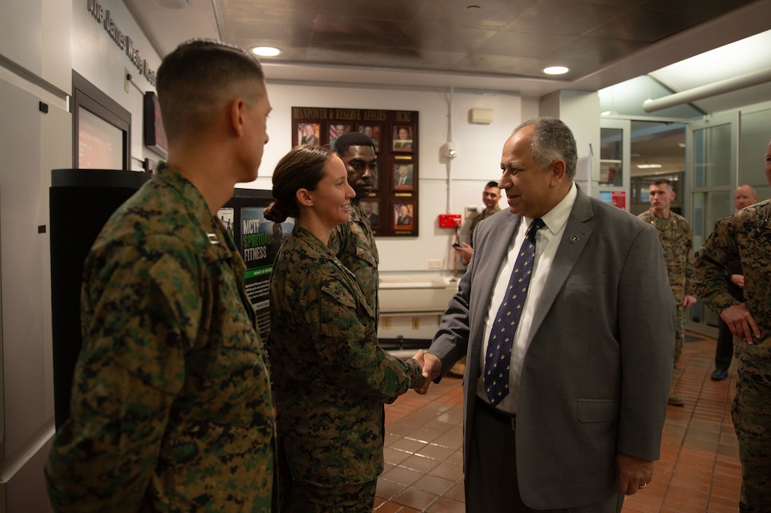 The Secretary of the Navy (SECNAV) Carlos Del Toro greets Marines assigned to Manpower and Reserve Affairs (M&RA) and Marine Corps Recruiting Command (MCRC) during a visit to Marine Corps Base Quantico