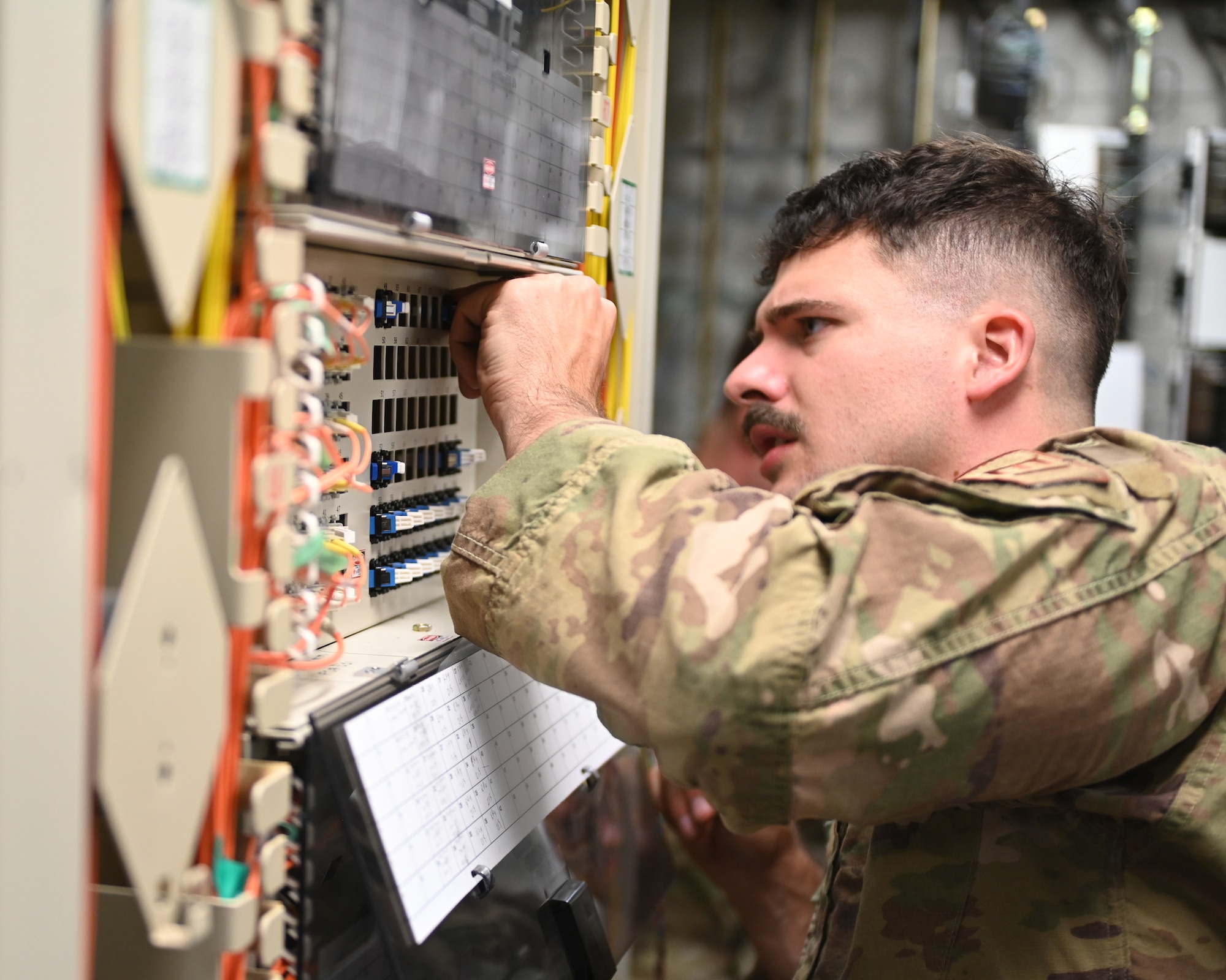 U.S. Air Force Airmen from the 210th Engineering Installation Squadron install over 3,000 feet of secondary fiber optic cable at Cheyenne Mountain Space Force Station, Colorado Springs, Colo., July 31, 2024.