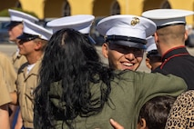 A new U.S. Marine from Delta Company, 1st Recruit Training Battalion, is greeted by a guest after a graduation ceremony at Marine Corps Recruit Depot San Diego, California, Nov. 1, 2024. Graduation took place at the completion of the 13-week transformation, which included training for drill, marksmanship, basic combat skills, and Marine Corps customs and traditions. (U.S. Marine Corps photo by Cpl. Alexander O. Devereux)