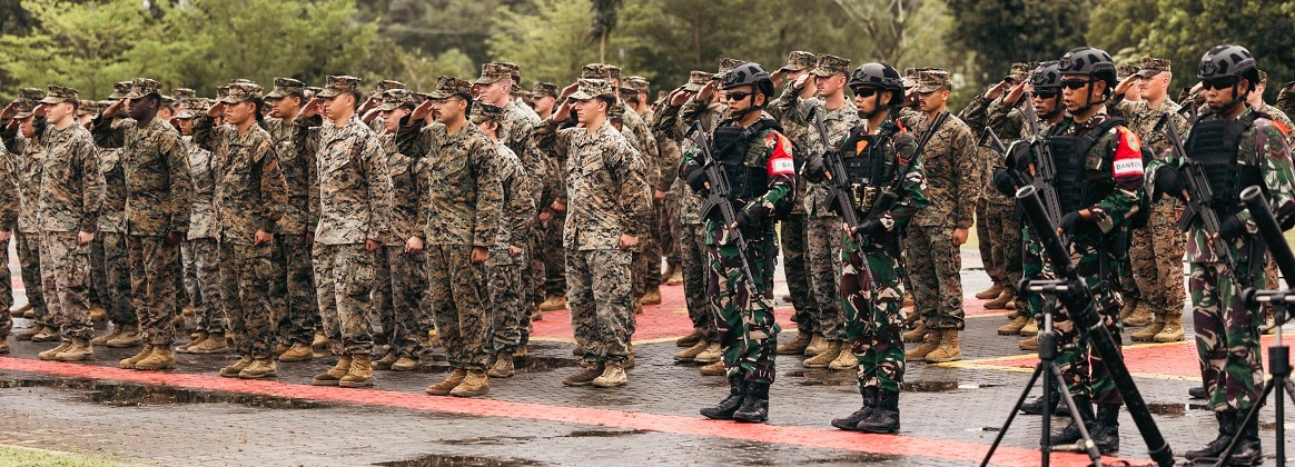 U.S. Marines with Marine Rotational Force-Southeast Asia, I Marine Expeditionary Force, and Indonesian marines with 10th Marine Infantry Battalion, Indonesian Korps Marinir, stand in formation during the Keris Marine Exercise (MAREX) 2024 Opening Ceremony at Yonif 10 Marinir, Batam, Indonesia, Nov. 6, 2024.