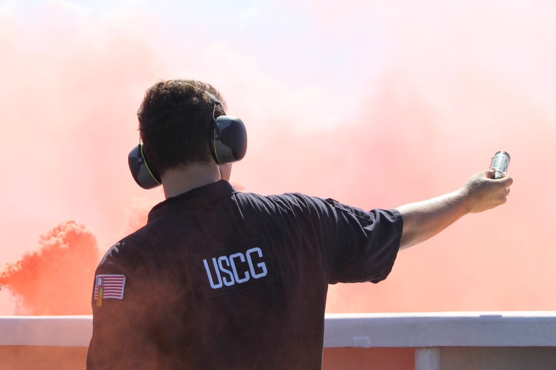 Petty Officer 3rd Class Anson Cordova, a machinery technician assigned to Coast Guard Cutter Reliance (WMEC 615), participates in pyrotechnic training aboard the cutter, Oct. 2, 2024, while at sea in the Windward Passage. Reliance’s crew completed a 60-day patrol in the Seventh Coast Guard District area of responsibility to conduct maritime safety and security missions. (U.S. Coast Guard photo by Ensign Sarah Kaleta)