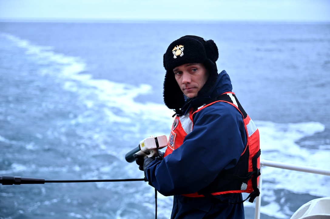 Lt. j.g. Lucas Doran, a National Oceanic and Atmospheric Administration (NOAA) Corps. officer temporarily assigned to the U.S. Coast Guard Cutter Healy (WAGB 20), prepares to deploy a hand-held Expendable Bathythermograph (XBT) probe from the Healy while operating in the Arctic, Oct. 30, 2024. Healy is the Coast Guard's only icebreaker explicitly designed to support research and provides high-latitude U.S. presence and access to areas for the scientific community challenging for most research vessels to reach. U.S. Coast Guard photo by U.S. Coast Guard photo by Senior Chief Petty Officer Matt Masaschi.