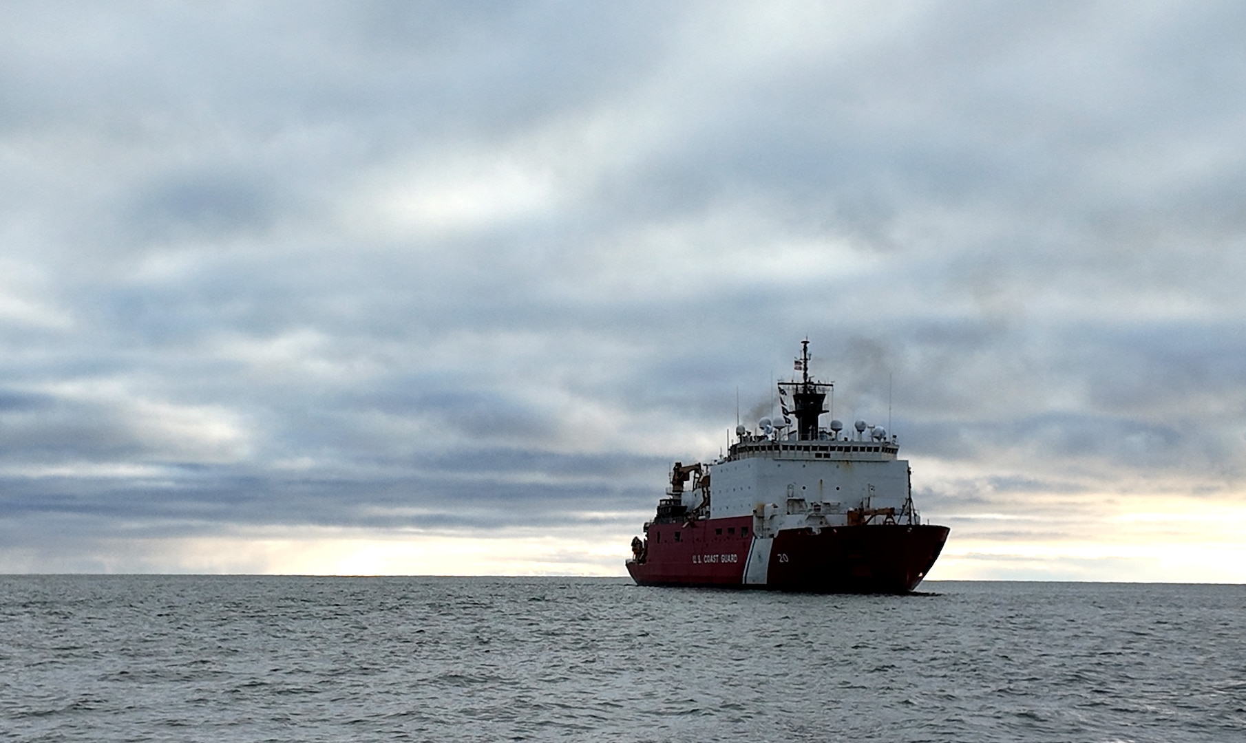 The U.S. Coast Guard Cutter Healy (WAGB 20) maneuvers off the coast of Nome, Alaska, following the completion of the first phase of their Fall 2024 deployment, Oct. 25, 2024. Healy’s crew supported an embarked science team during the first phase and conducted the Alaskan Arctic Coast Port Access Route Study (AACPARS) and opportunistic mapping, which included bathymetric mapping in the Chukchi and Beaufort Seas. U.S. Coast Guard photo by Senior Chief Petty Officer Matt Masaschi.