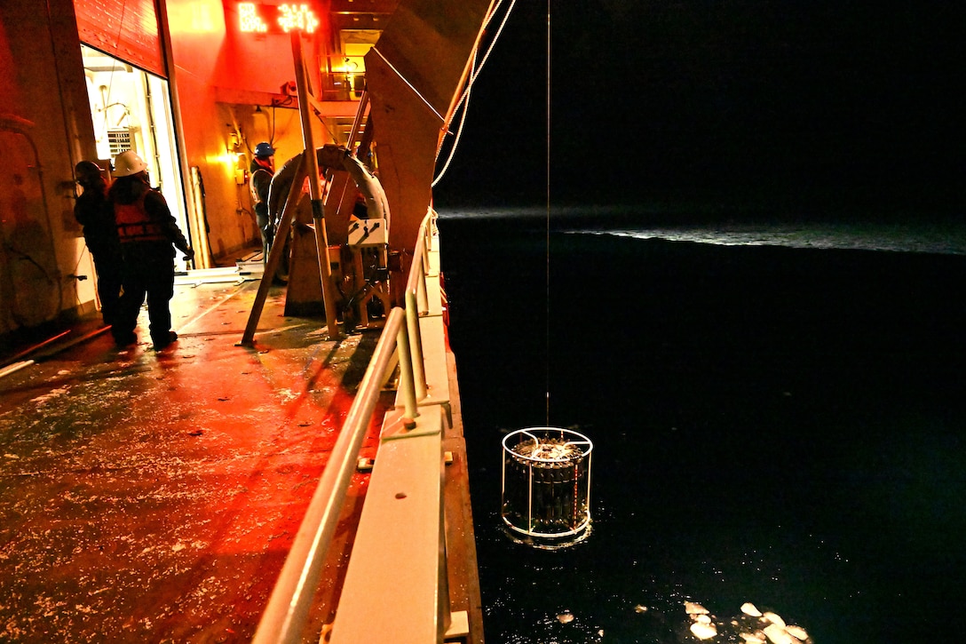 U.S. Coast Guard Cutter Healy (WAGB 20) crewmembers retrieve a Conductivity, Temperature, and Depth (CTD) instrument from the Chukchi Sea, Oct. 27, 2024. Healy’s crew has supported the embarked scientists by deploying equipment and instruments for collecting water samples and data throughout their Arctic deployment. U.S. Coast Guard photo by Senior Chief Petty Officer Matt Masaschi.