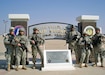 Capt. Elle Johnson (second from right) stands with her squad during her deployment in Iraq. As the first female finance officer on an all-male mobile team, Johnson helped establish critical financial systems alongside Iraqi leaders.