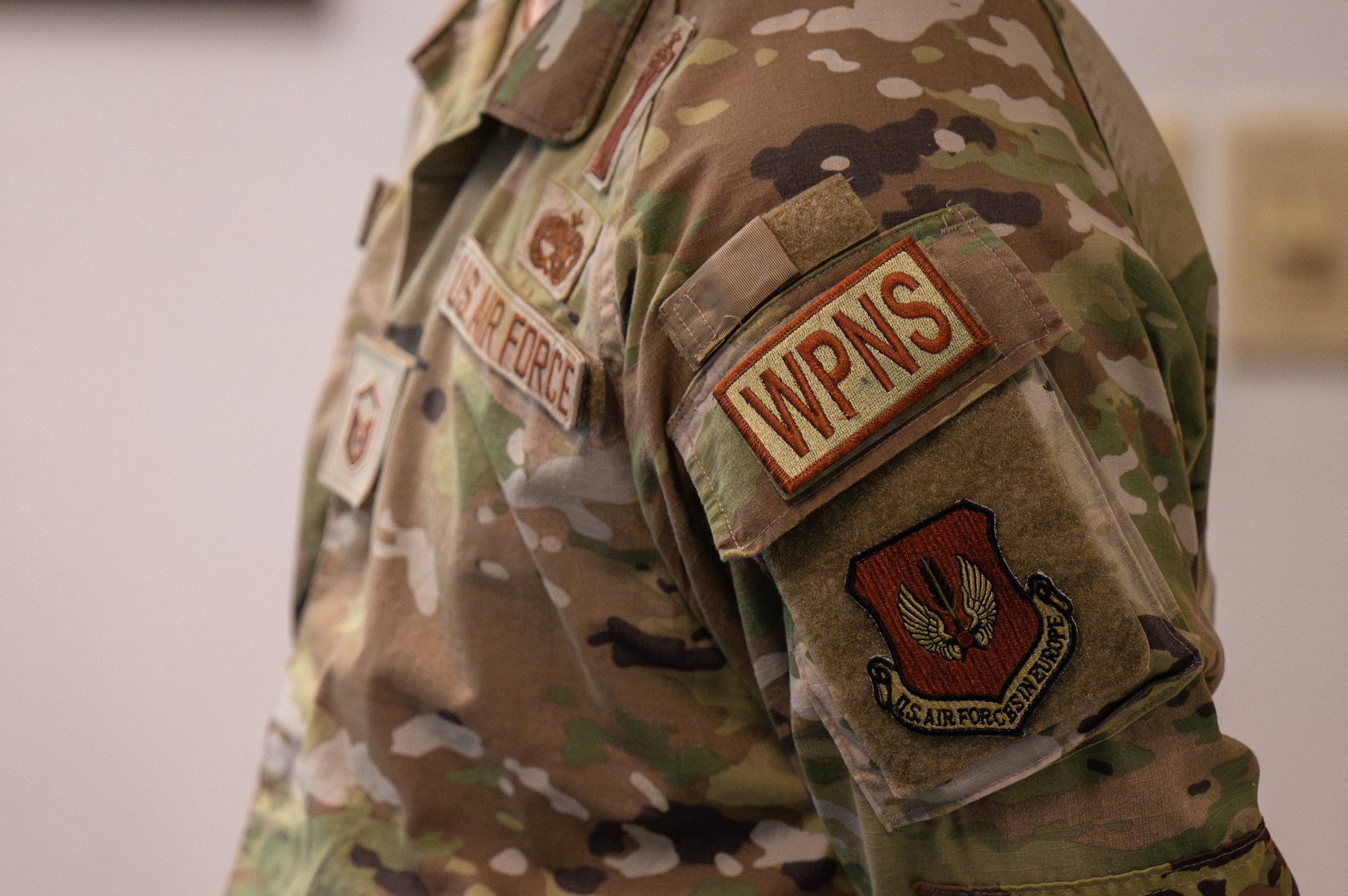 A close up of a WPNS duty identifier patch on an Airman.