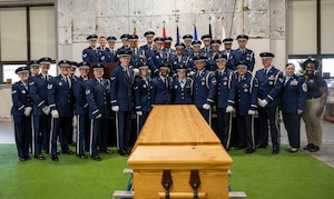 Base honor guard graduates pose for a group photo during a graduation ceremony at Wright-Patterson Air Force Base, Ohio, Oct. 30, 2024. The WPAFB Honor Guard provides military funeral honors for fallen veterans, retirees and active-duty service members and presents the colors for eligible retirement, promotion ceremonies and special events. (U.S. Air Force photo by Jack Gardner)