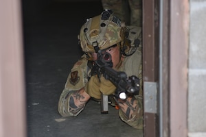 Master Sgt. Jered Dauterman, 341 MSOS/TRF flight chief, participates in an urban recovery scenario during Joint Training Exercise 2024, at Fort Chaffee, Arkansas, October 15, 2024. During the three-week JTX, Twentieth Air Force Security Forces airmen refined critical response skills alongside the U.S. Office of Secure Transportation and Royal Marines. The exercise provided hands-on experience with advanced weapons handling, live-fire drills, and urban recovery scenarios, enhancing readiness for nuclear security operations. (U.S. Air Force Photo by 1st Lt. Jacqulyn Noffsinger)