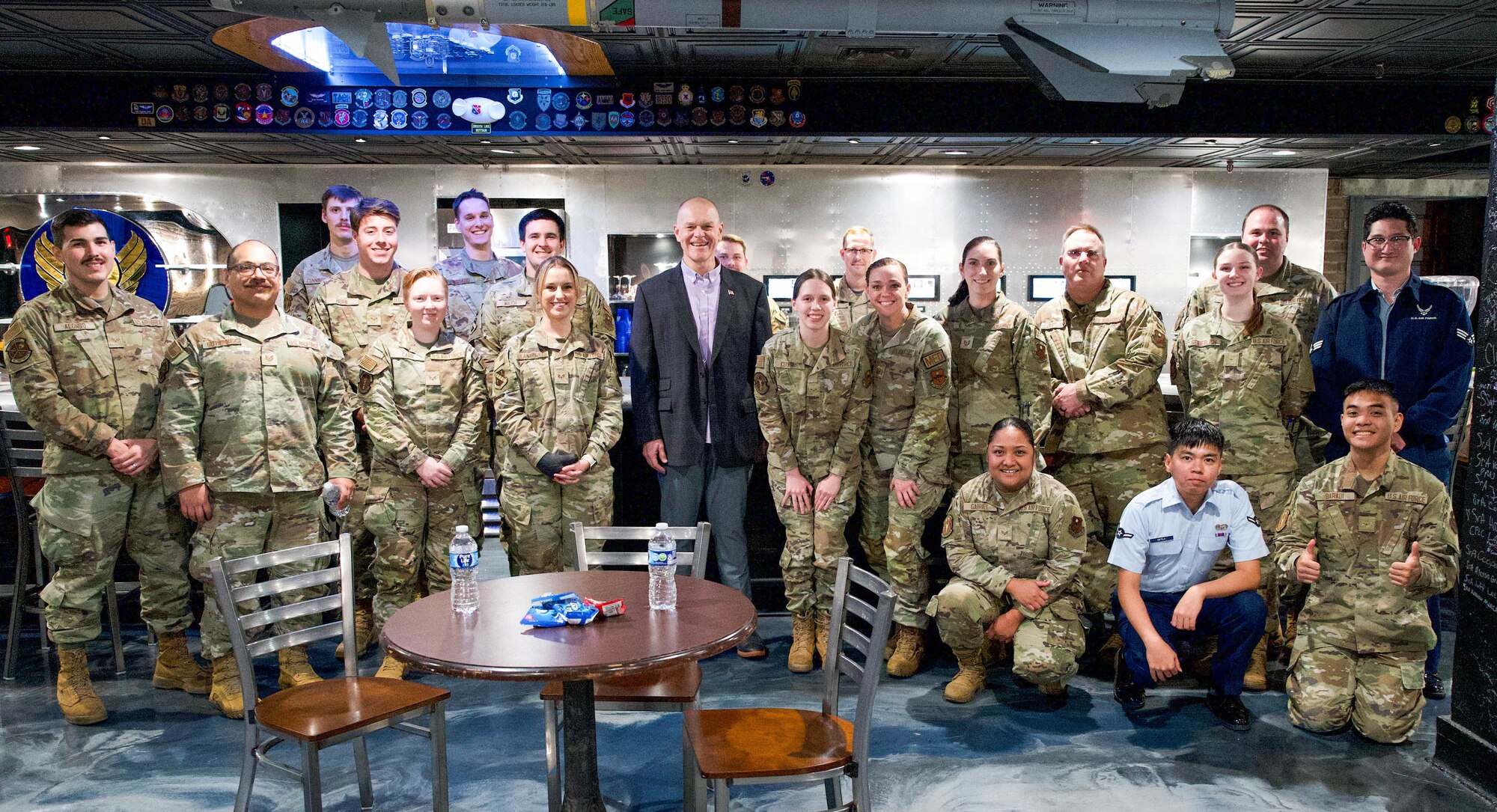 Former CMSAF poses for a photo with U.S. Airmen.