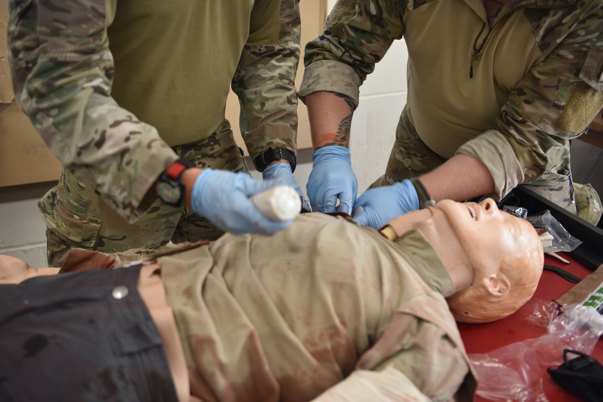 Airmen from across Twentieth Air Force practice Tactical Combat Casualty Care skills during Joint Training Exercise 2024, at Fort Chaffee, Arkansas, October 15, 2024. During the three-week JTX, Twentieth Air Force Security Forces airmen refined critical response skills alongside the U.S. Office of Secure Transportation and Royal Marines. The exercise provided hands-on experience with advanced weapons handling, live-fire drills, and urban recovery scenarios, enhancing readiness for nuclear security operations. (U.S. Air Force Photo by 1st Lt. Jacqulyn Noffsinger)