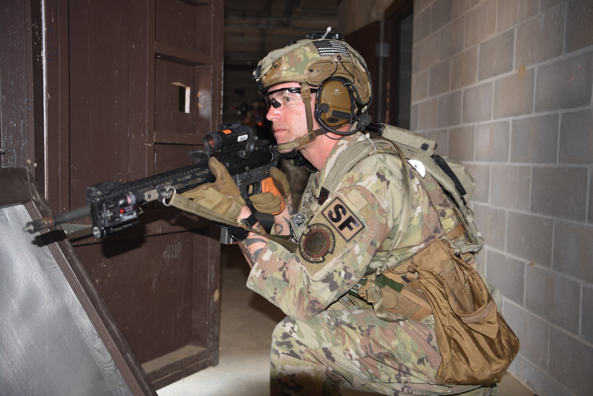 Master Sgt. Jered Dauterman, 341 MSOS/TRF flight chief, participates in an urban recovery scenario during Joint Training Exercise 2024, at Fort Chaffee, Arkansas, October 15, 2024. During the three-week JTX, Twentieth Air Force Security Forces airmen refined critical response skills alongside the U.S. Office of Secure Transportation and Royal Marines. The exercise provided hands-on experience with advanced weapons handling, live-fire drills, and urban recovery scenarios, enhancing readiness for nuclear security operations. (U.S. Air Force Photo by 1st Lt. Jacqulyn Noffsinger)