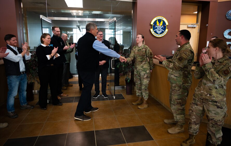 Dr. William LaPlante, Under Secretary of Defense for Acquisition and Sustainment (left), coins members of Team Minot at Minot Air Force Base, North Dakota, Oct. 31, 2024. LaPlante’s visit underscores his commitment to advancing acquisition practices, sustaining military infrastructure and reinforcing the nation’s defense capabilities. (U.S. Air Force photo by Airman 1st Class Luis Gomez)
