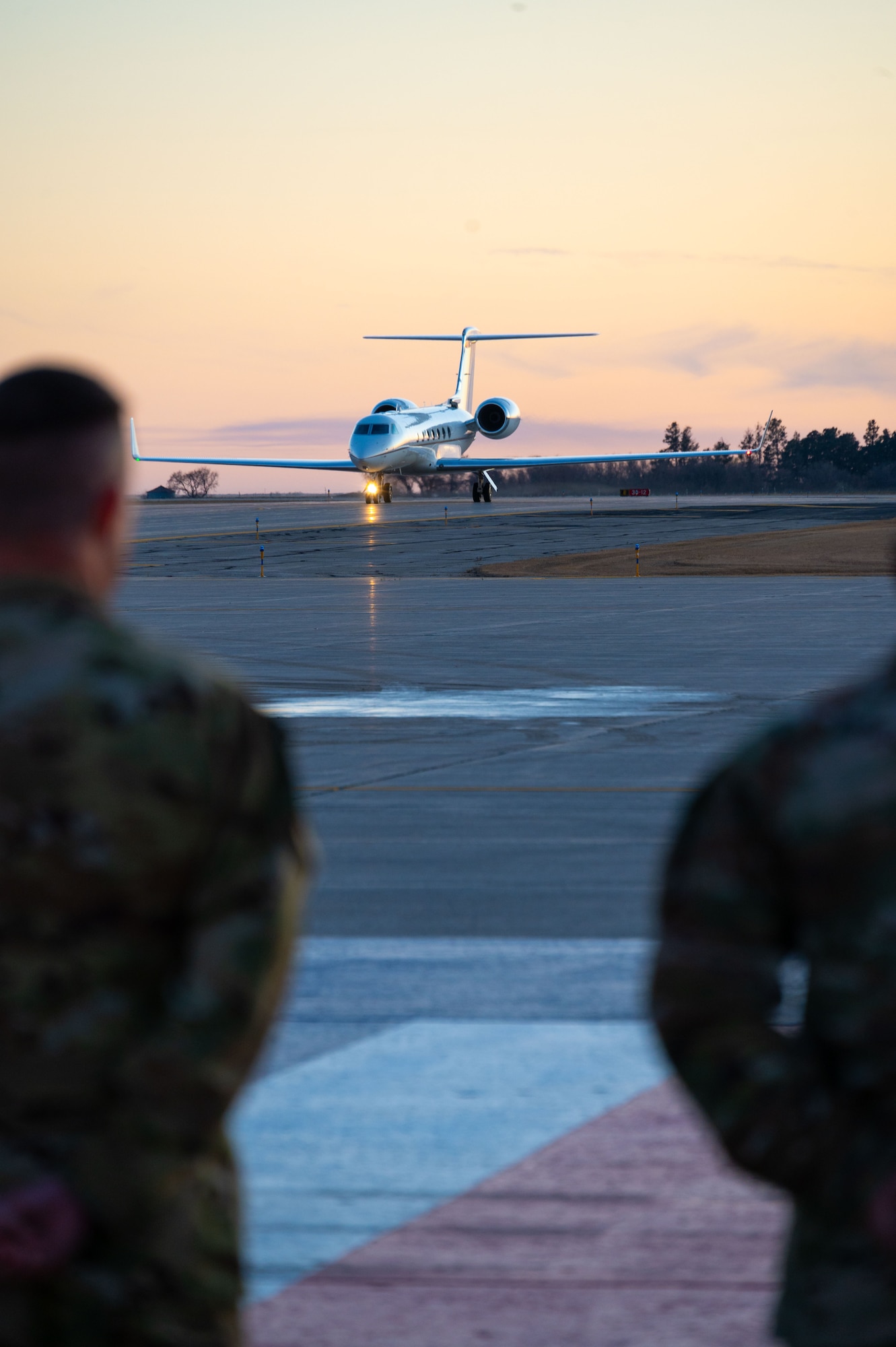 Team Minot leadership awaits the arrival of Dr. William LaPlante, Under Secretary of Defense for Acquisition and Sustainment, at Minot Air Force Base, North Dakota, Oct. 30, 2024. LaPlante is responsible for all matters pertaining to acquisition; contract administration; logistics and materiel readiness; installations and environment; operational energy; nuclear, chemical, and biological defense; the acquisition workforce; and the defense industrial base. (U.S. Air Force photo by Airman 1st Class Luis Gomez)