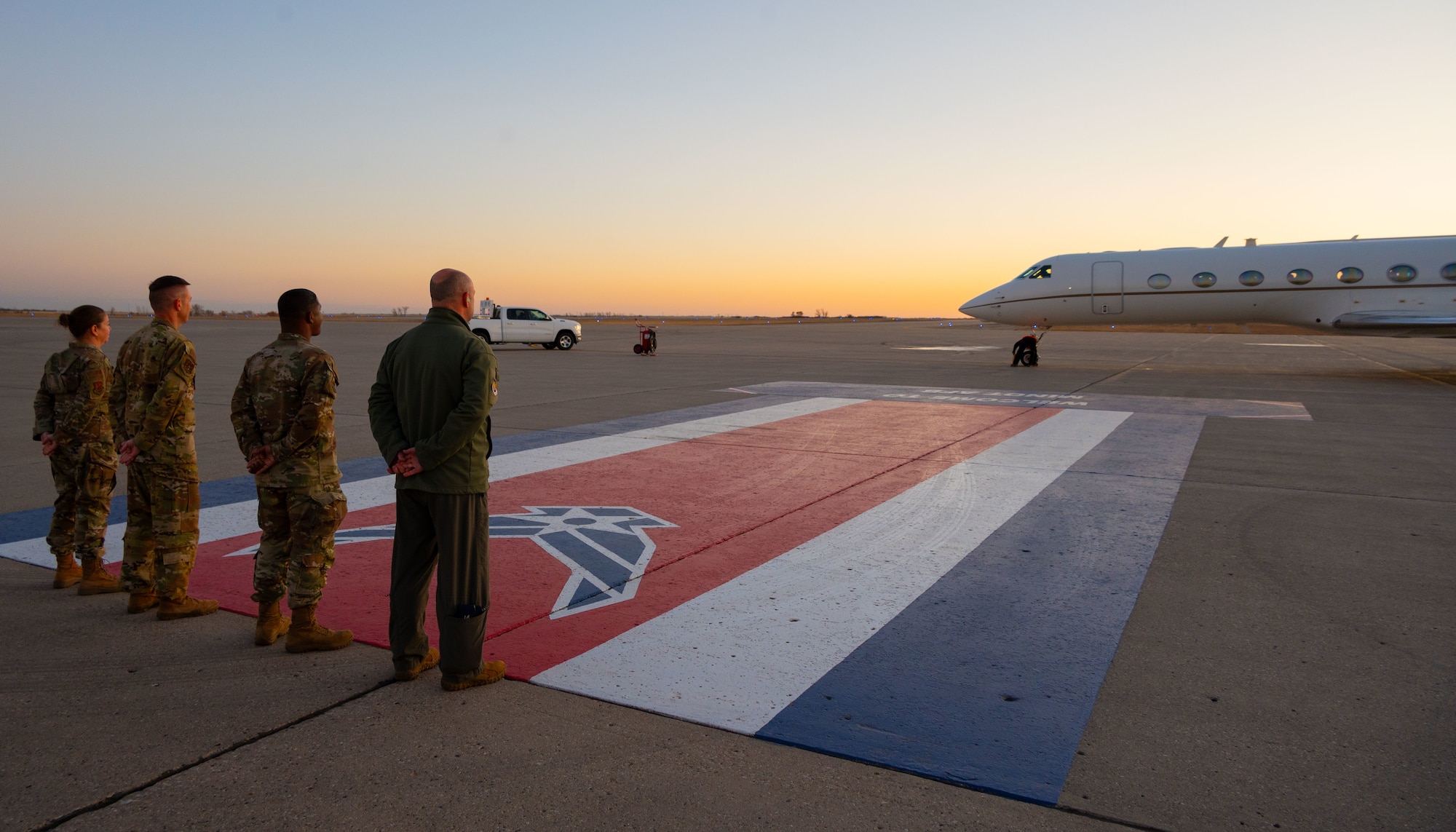 Team Minot leadership look on as Dr. William LaPlante, Under Secretary of Defense for Acquisition and Sustainment, arrives at Minot Air Force Base, North Dakota, Oct. 30, 2024. LaPlante is responsible for all matters pertaining to acquisition; contract administration; logistics and materiel readiness; installations and environment; operational energy; nuclear, chemical, and biological defense; the acquisition workforce; and the defense industrial base. (U.S. Air Force photo by Airman 1st Class Luis Gomez)