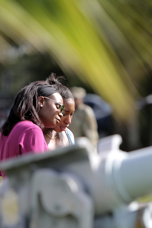 Kaiya Bell, right, daughter of Staff Sgt. Dante Bell, is comforted during a unit memorial ceremony for Bell who died last month in a training incident.