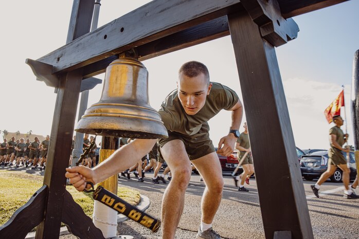 A new U.S. Marines with Delta Company, 1st Recruit Training Battalion, rings a liberty bell during a motivational run at Marine Corps Recruit Depot San Diego, California, Oct. 31, 2024. The company motivational run is a three-mile cadence run conducted around the Depot and is the last physical training event the Marines will conduct before the graduate from MCRD San Diego. The event is also the first time friends and families will see their newly transformed Marines. (U.S Marine Corps photo by Cpl. Sarah M. Grawcock)