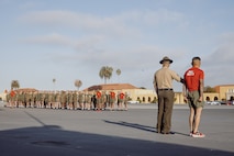 U.S. Marines with Delta Company, 1st Recruit Training Battalion, stand in formation before their motivational run at Marine Corps Recruit Depot San Diego, California, Oct. 31, 2024. The company motivational run is a three-mile cadence run conducted around the Depot and is the last physical training event the Marines will conduct before the graduate from MCRD San Diego. The event is also the first time friends and families will see their newly transformed Marines. (U.S Marine Corps photo by Cpl. Sarah M. Grawcock)